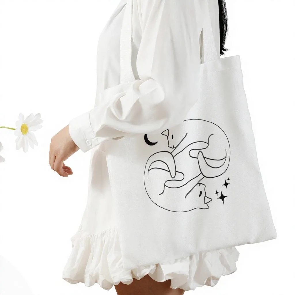 White canvas shoulder tote with black cat illustration